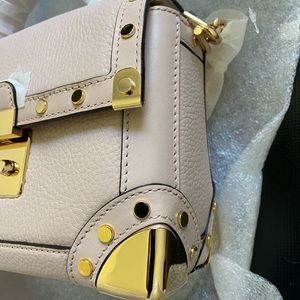 Michael Kors, Brand new, soft pink, golden hardware. 8.25/6/3.5 inch.